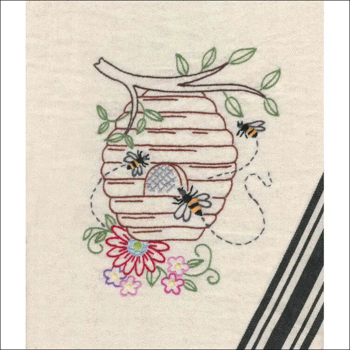 Embroidered beehive with bees and flowers from Aunt Martha’s Buzzing Bees pattern