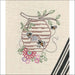 Embroidered beehive with bees and flowers from Aunt Martha’s Buzzing Bees pattern