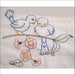 Hand-embroidered blue birds on a flowering branch from Aunt Martha’s Love in Bloom collection